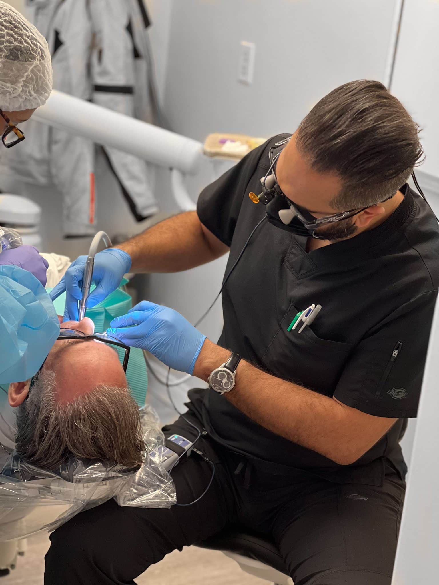 Dr. Shawn providing service on patient