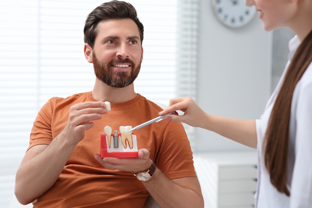 Patient being educated about dental implants