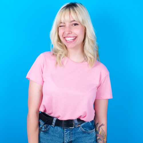 Caucasian,Girl,Wearing,Pink,T shirt,Isolated,Over,Blue,Background,Blinking