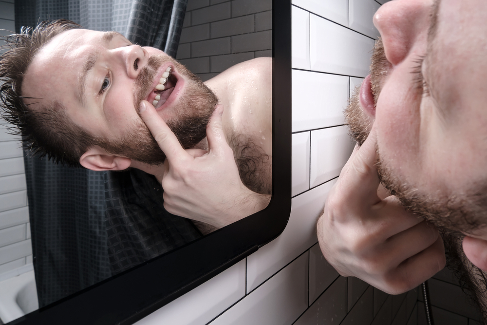 Man,Opened,His,Mouth,And,Carefully,Examines,The,Absence,Of