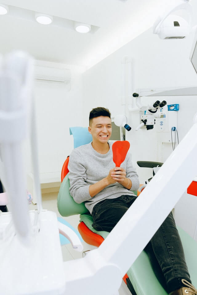 Man smiling after cosmetic dental treatment