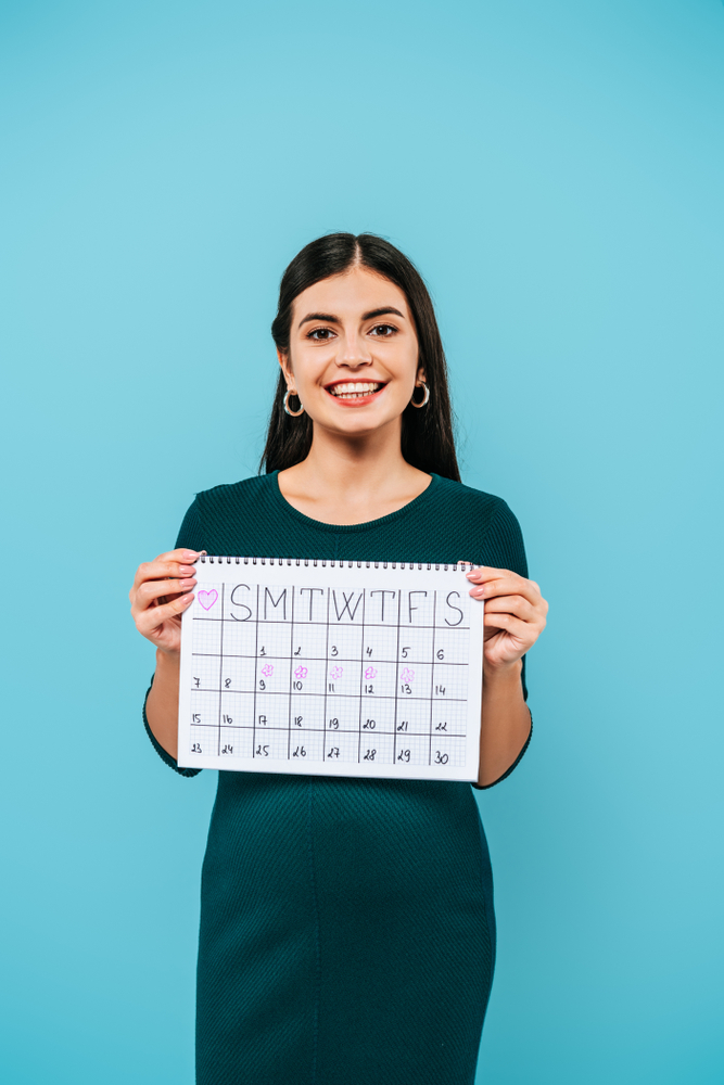 Smiling Patient Holding Calendar